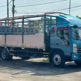 Giá xe tải JAC N900 thùng nhôm xe tải JAC N900 thùng nhôm màu xanh ngọc mới